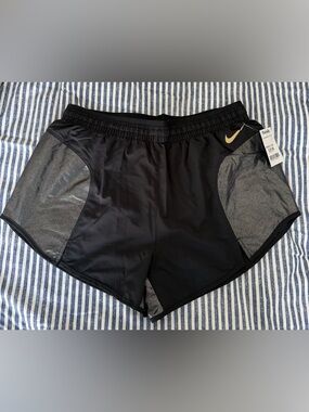 Nike Black Athletic Shorts with Gray Panels and Gold Swoosh